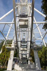Ferris wheel on the background of blue sky