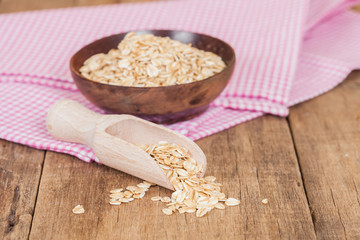 oats in spoon on wood table