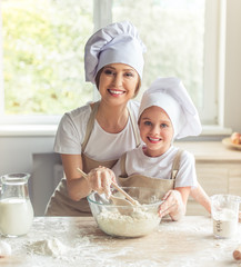 Mother and daughter baking