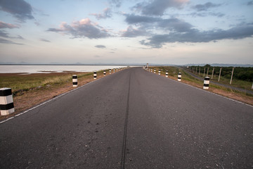 asphalt road at sunset