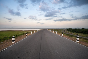 asphalt road at sunset