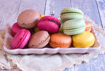 colourful french macaroons on plate
