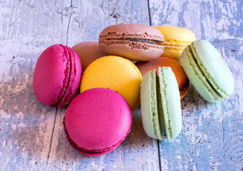 Delicious french macaroons on wooden table