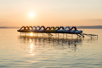 Sunset over paddle boats in the lake Balaton, Hungary
