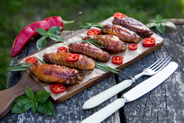 Baked spicy chicken wings in the Asian style