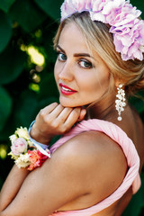 Naklejka premium Pretty blonde bridesmaid outdoors