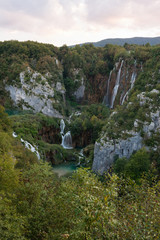 Grand view of Plitvice National Park, Croatia - the Big Waterfall, lower lake during sunset