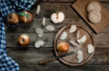 vintage. fruit. ripe apples, cookies, old knife and a kitchen towel on the  wooden table. Top view