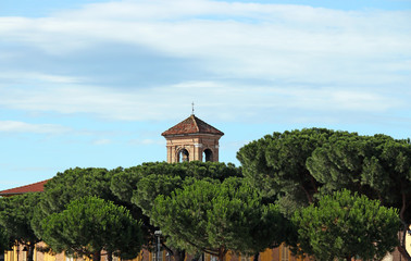 old church tower and pine trees Rimini Italy