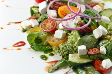 salad with pesto sauce and mozzarella