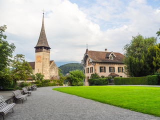 Fototapeta na wymiar Iglesia en los jardines del castillo de Spiez en Suiza , a orillas del lago ThunerseeOLYMPUS DIGITAL CAMERA