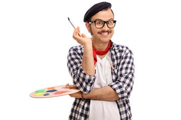 Painter holding a paintbrush and a color palette