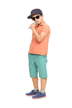 Young rapper posing with a microphone