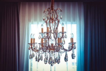 vintage shining chandelier and curtain