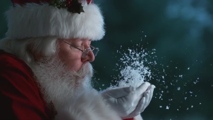 Santa Claus blowing snow from hands in slow motion, Phantom Flex 4K - Powered by Adobe