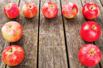 red apples on wooden background