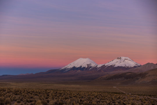 Sunset in Andes. Parinacota and Pomerade volcanos.