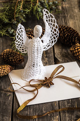 White crocheted angel with a Christmas envelope