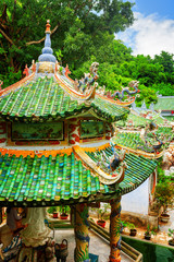 Scenic tile roofs with mosaic sculptures at the Linh Ung Pagoda