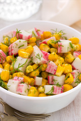 salad seafood with corn in white bowl