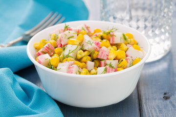 salad seafood with corn in white bowl