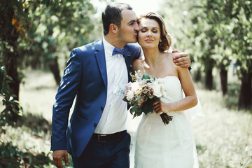 Beautiful couple of happy stylish newlyweds