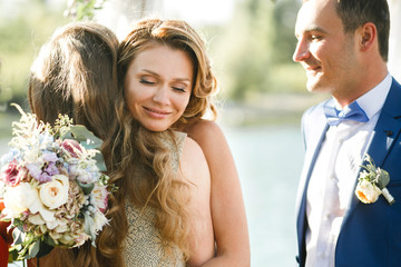 Happy stylish newlyweds on wedding day