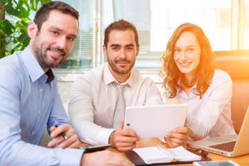 Fototapeta premium Group of business associates working together at the office