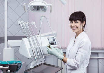 Dentist brunette portrait in the clinic.