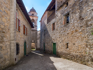 Fototapeta na wymiar Italian Medieval village street in north Tuscany. Village - Biglio.