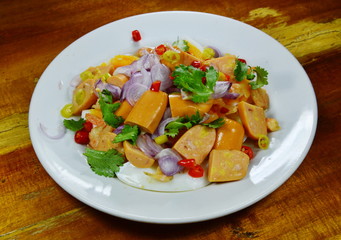 spicy pork sausage and boiled egg with dried shrimp salad on plate