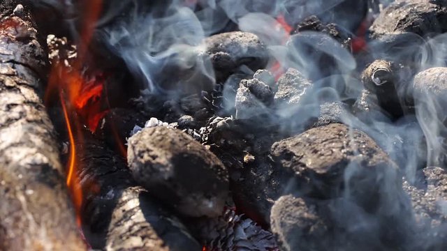 Burning coal and wood.