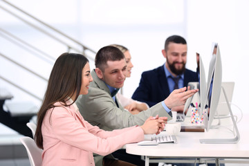 Naklejka premium People working on computers at a office