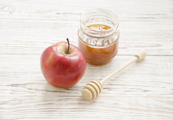 Honey with red apple