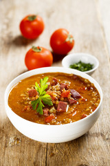 Tomato soup with lentils and sausages
