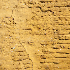 square part of ochre yellow washed wall