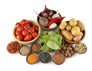 Vegetables and spices on white background