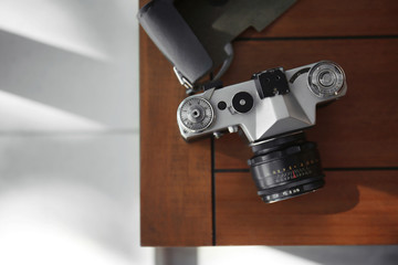 Vintage camera on wooden table