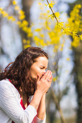 Woman sneezing