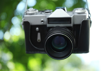 Vintage camera on blurred background