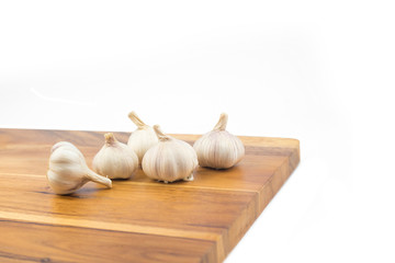 Garlic on wood background