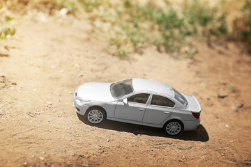 Fototapeta na wymiar Close up of toy car on ground