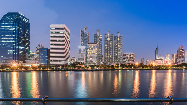 Cityscape at Benchakitti park , green lung of Bangkok , in the evening , Thailand