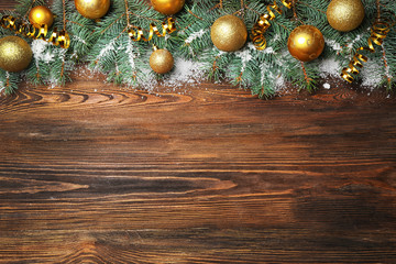 Christmas fir tree on wooden background