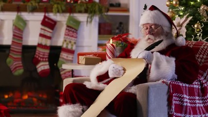 Santa Claus writing on list