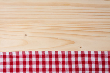 Checkered tablecloth red on the wooden background/ texture 