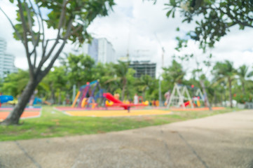 Blur of Colorful playground on yard in the park.