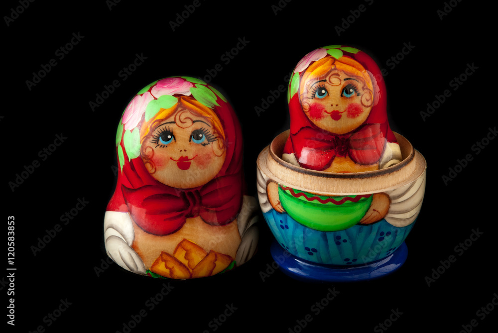 Wall mural Matryoshka isolated on black background