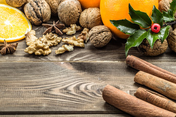 Christmas setting with seasonal spices and fruits.