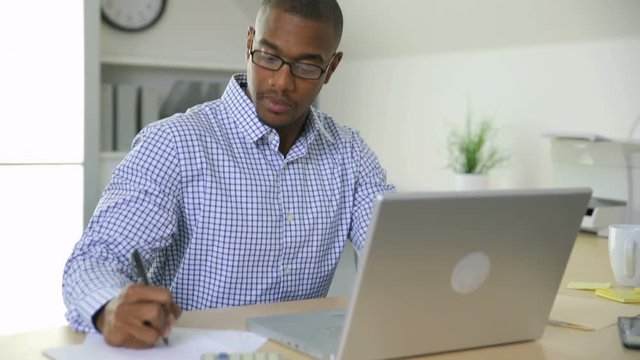 Businessman working on computer in office